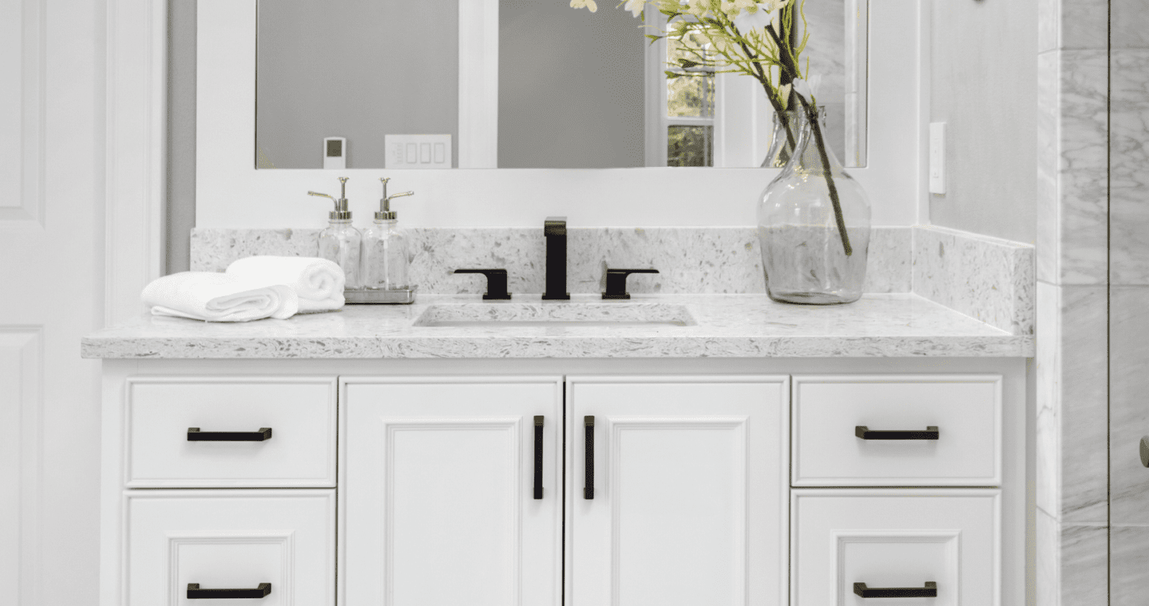 white bathroom vanity with white countertop